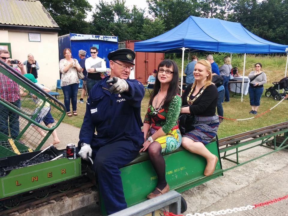 All aboard! Autistic Pride Reading organiser Rachel Cotton, centre, and the Mayor of Reading, Cllr Sarah Hacker, take to the tracks at last year's event